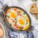 Cheesy Baked Eggs with Tomato and Spinach