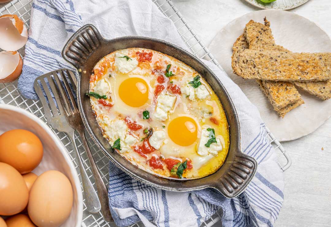 Cheesy Baked Eggs with Tomato and Spinach