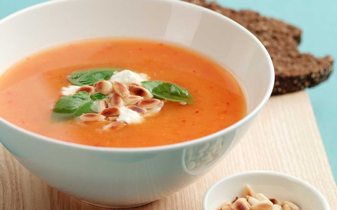 Sweet potato soup with feta and pine nuts